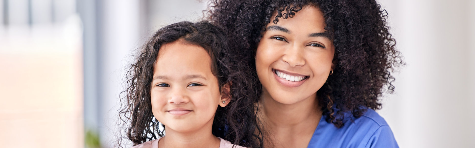 a child and nurse smiling