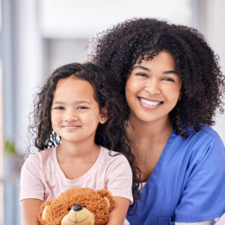 a child and nurse smiling